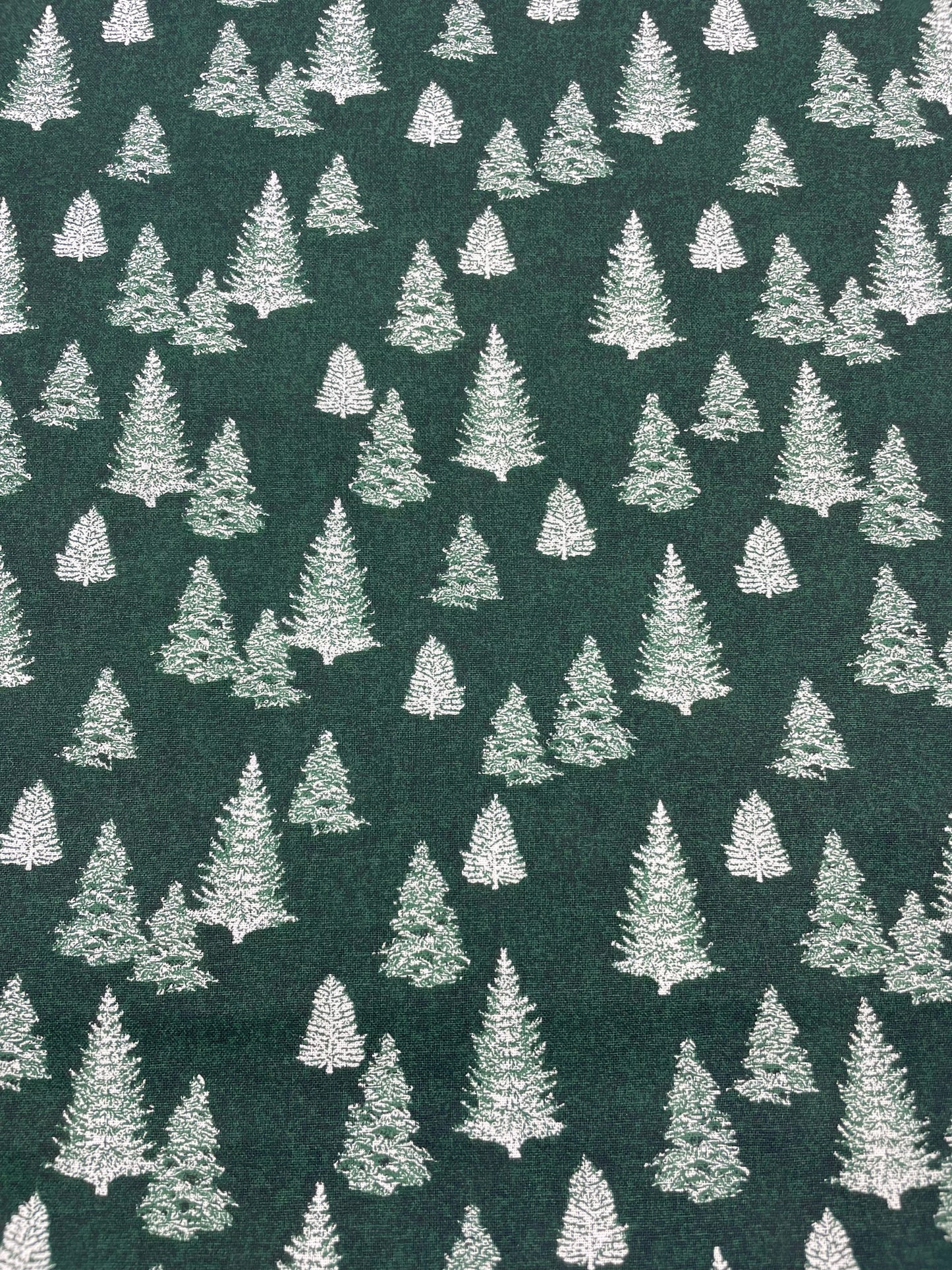 White Evergreens on Forest Green